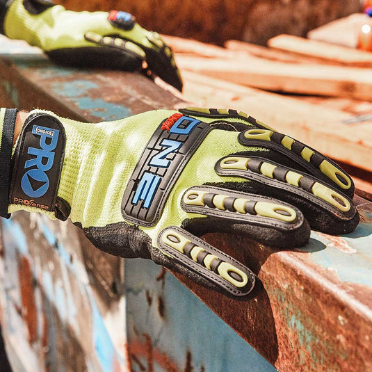 A close up of a sturdy pair of hi vis workers gloves. The gloves have additional protection on the fingers and look to provide good hand protection.