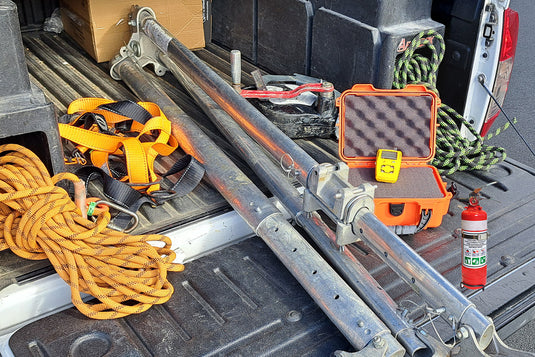 Some height safety and gas detection equipment in the back of a work vehicle. The equipment includes service tags showing Active Safety's offering of equipment servicing for ropes, harnesses, tripods, gas detectors and fire extinguishers.