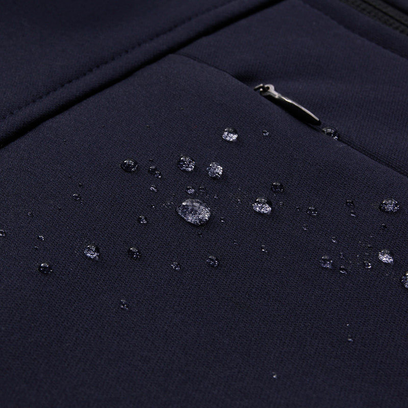 Load image into Gallery viewer, Biz Ladies Soft Shell Jacket with water droplets, highlighting its water-resistant feature. Features include two-way zip, chest pocket with audio port, and adjustable cuffs, ideal for safety and work environments.