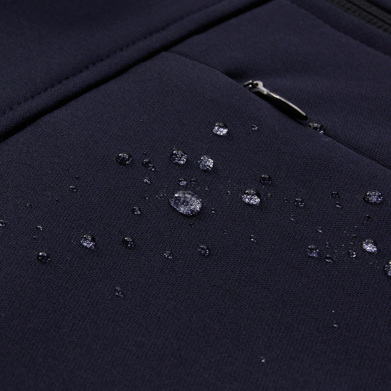 Load image into Gallery viewer, Biz Mens Soft Shell Jacket with water droplets, showcasing its water-repellent feature. Features include a stand-up collar, zippered pockets, and adjustable cuffs, ideal for active safety and workwear needs.
