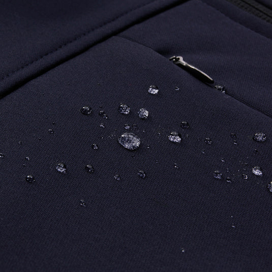 Biz Mens Soft Shell Jacket with water droplets, showcasing its water-repellent feature. Features include a stand-up collar, zippered pockets, and adjustable cuffs, ideal for active safety and workwear needs.