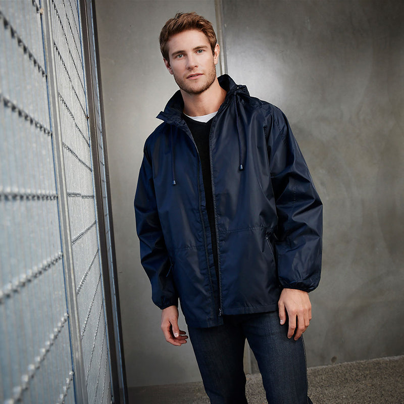 Load image into Gallery viewer, The Biz Unisex Spinnaker Jacket, a lightweight spray jacket worn by a male model, features a hooded design with a concealed zippered front, angled zippered pockets, and elasticated cuffs, ideal for unpredictable rain.