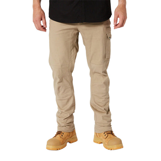 Jetpilot Fueled Utility Pant showcases slim-fit design with a right thigh cargo pocket, paired with sturdy lace-up work boots, emphasizing comfort and flexibility for active work environments.