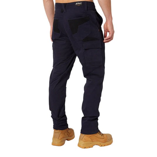 Jet Pilot Fueled Utility Pant with multiple side and back pockets, worn with tan work boots, showcasing durable design perfect for active work environments and enhanced movement with stretch fabric.