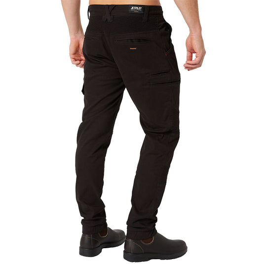 Jetpilot Fueled Corrugated Stretch Pant with ribbed knees, zip and flap pockets, worn with brown leather boots. Features reinforced knees and elasticated cuffs, ideal for active work environments.