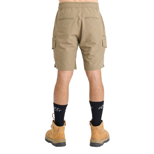 Rear view of a person wearing Jetpilot Jet Lite Hybrid 20 Utility Shorts with multiple pockets, black crew socks, and tan work boots, showcasing practicality for active safety and workplace environments.