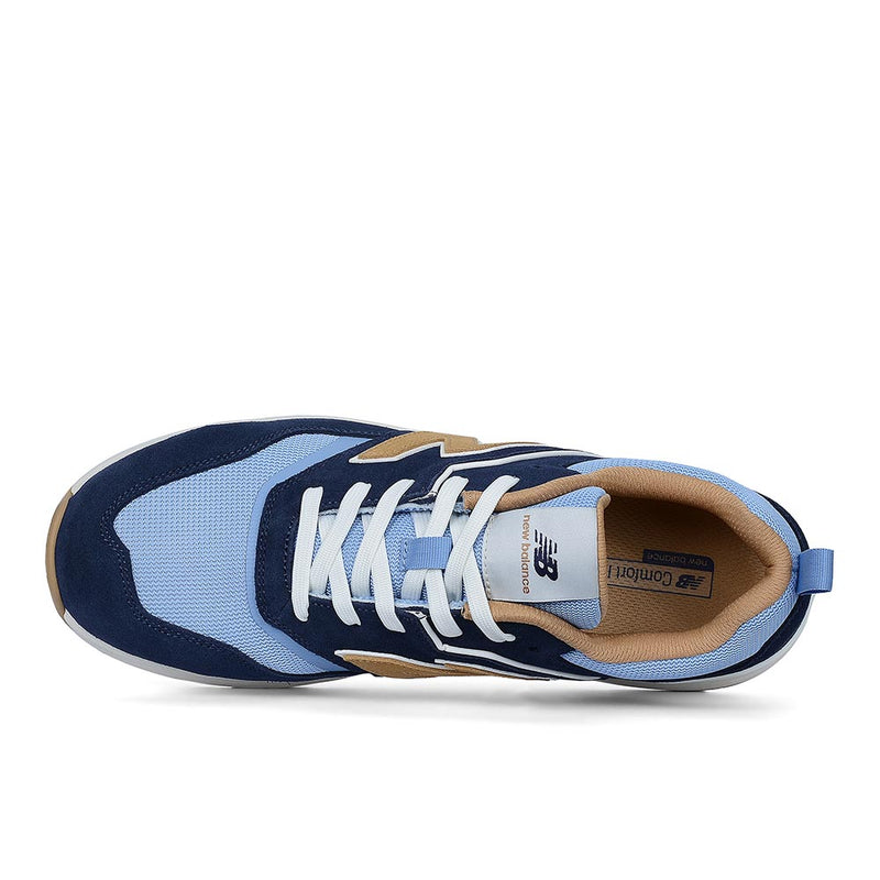 Load image into Gallery viewer, New Balance Elite Lite Safety Shoe, Blue/Coffee, features a light blue mesh with navy suede overlays, white laces, and a white midsole, designed for comfort and workplace safety.