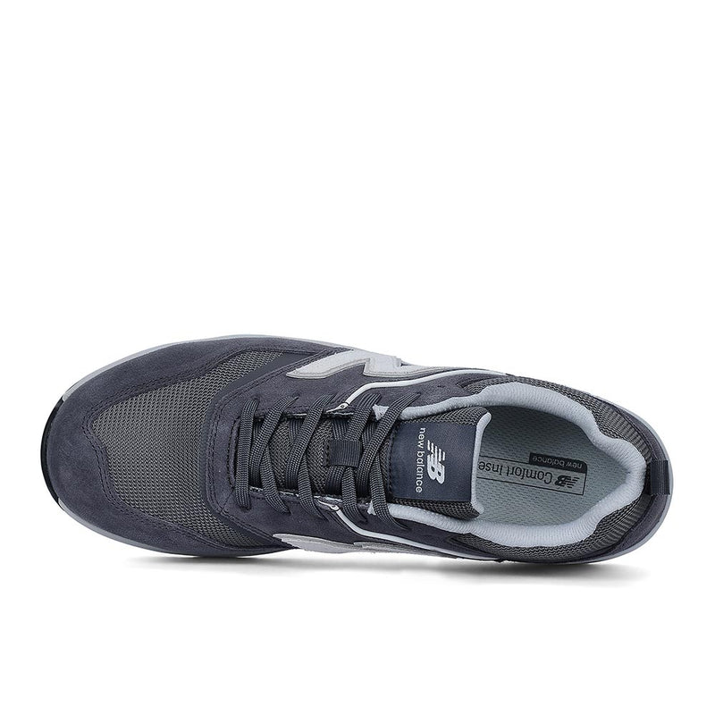 Load image into Gallery viewer, New Balance Elite Lite Safety Shoe, Grey/White from above, featuring mesh and suede panels, New Balance logos, composite safety toe, slip-resistant outsole, and a lightweight design for comfort and workplace safety.