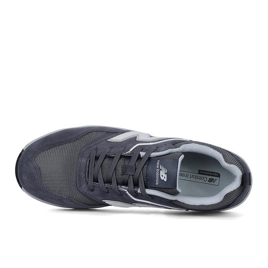 New Balance Elite Lite Safety Shoe, Grey/White from above, featuring mesh and suede panels, New Balance logos, composite safety toe, slip-resistant outsole, and a lightweight design for comfort and workplace safety.