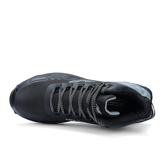 New Balance Fresh Foam Cremorne Mid 2E Safety Boot features a black mesh upper, protective toe bumper, patterned laces, and reflective accents, offering superior comfort and durability for industrial environments.