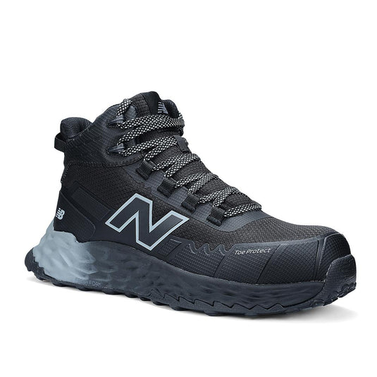New Balance Fresh Foam Cremorne Mid 2E Safety Boot, Black/Grey, features a durable design with a lugged sole, reinforced toe overlay, patterned laces, and ankle-supporting mid-top style, ideal for workplace safety.