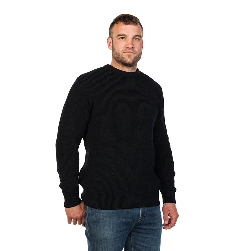 Load image into Gallery viewer, MKM Backyard Wool Jersey: A man models this durable New Zealand wool sweater, ideal for outdoor workwear. Its classic crewneck design and looser fit make it perfect for layering in colder climates.