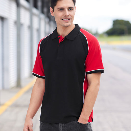 Biz Nitro Short Sleeve Polo Shirt featuring bold contrast panels, knitted collar, and cuff. Made from durable pique fabric, ideal for workplace uniforms. Includes a loose pocket for added utility.