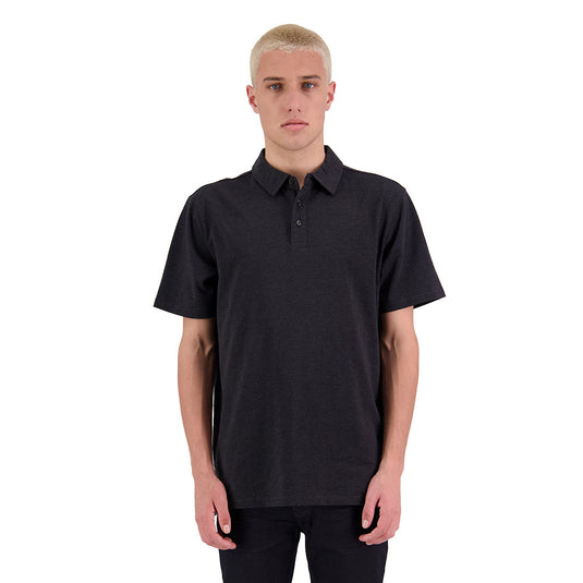Element Mens Short Sleeve Polo showcased by man in black shirt, highlighting durable, heavyweight fabric with self-fabric collar and contrast trim, ideal for versatile wear in various settings.