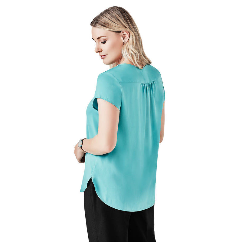 Load image into Gallery viewer, Biz Womens Kayla V-Neck Pleat Blouse with cap sleeves, elegant front and back pleat detailing, and a longer curved back hem, designed for a sophisticated and comfortable fit.