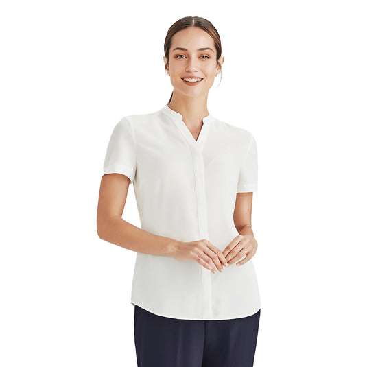 Biz Juliette Women’s Plain Blouse, featuring a concealed placket and hidden bust button, offers an easy fit with a back box pleat for extra movement, ideal for professional workwear.