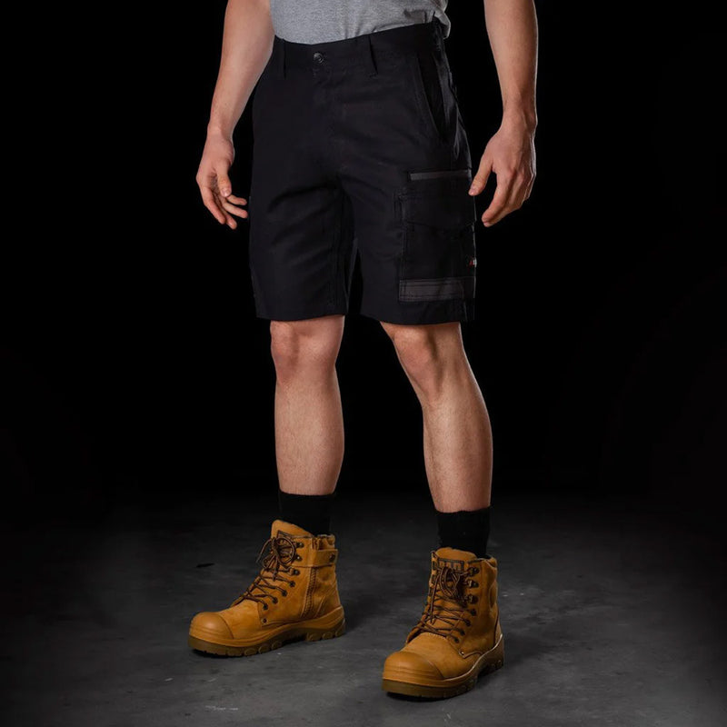 Load image into Gallery viewer, BAD Attitude Slim Fit Work Shorts with reinforced pockets and tool storage features, shown on a model wearing brown boots, ideal for workwear from Active Safety's collection.