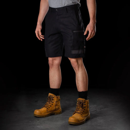 BAD Attitude Slim Fit Work Shorts with reinforced pockets and tool storage features, shown on a model wearing brown boots, ideal for workwear from Active Safety's collection.