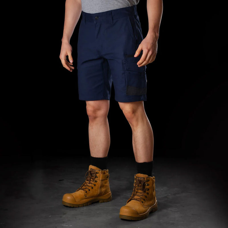 Load image into Gallery viewer, BAD Attitude Slim Fit Work Shorts showcased with durable brown boots, highlighting reinforced pockets and elastic waist. Ideal for active work environments, reflecting Active Safety's commitment to reliable workwear.