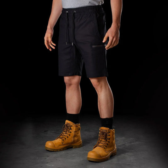 BAD Saviour Elastic Waist Work Shorts shown with black fabric, featuring an adjustable drawstring and reinforced pockets; paired with brown boots, highlighting its lightweight, breathable design suitable for active work environments.