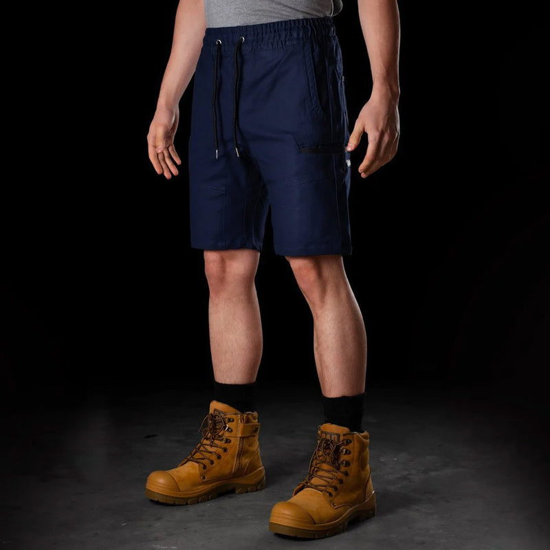 Load image into Gallery viewer, BAD Saviour Elastic Waist Work Shorts worn by a man, showcasing adjustable drawstring, reinforced pockets, and 4.5-inch inseam, paired with brown boots, highlighting practicality for active work environments.