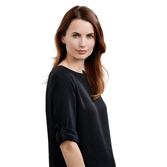 Biz Womens Madison Boatneck Top features an elegant boatneck, shirt-tail hem, and roll-up sleeves, offering a streamlined silhouette perfect for the professional woman seeking minimalist chic in workplace attire.