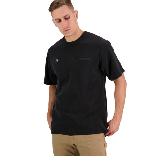 Swanndri Catlins Fleece T-Shirt worn by a man, featuring a chest zip pocket and brand patch. Ideal for layering in various weather, aligning with Active Safety's versatile workwear offerings.