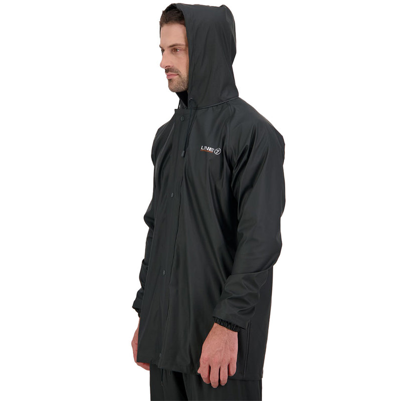 Load image into Gallery viewer, Line 7 Station Jacket V2, Green, showcased on a man wearing a black raincoat, highlighting its waterproof and flexible design, perfect for outdoor work in wet conditions.