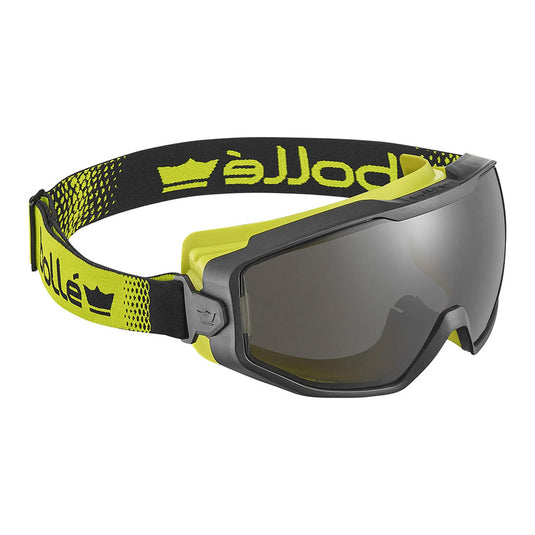 Bolle Spectrum Goggle Vented: Smoke, featuring a bi-material frame with an adjustable strap, offers panoramic vision and superior UVA/UVB protection, ideal for workplace safety and ergonomic comfort.