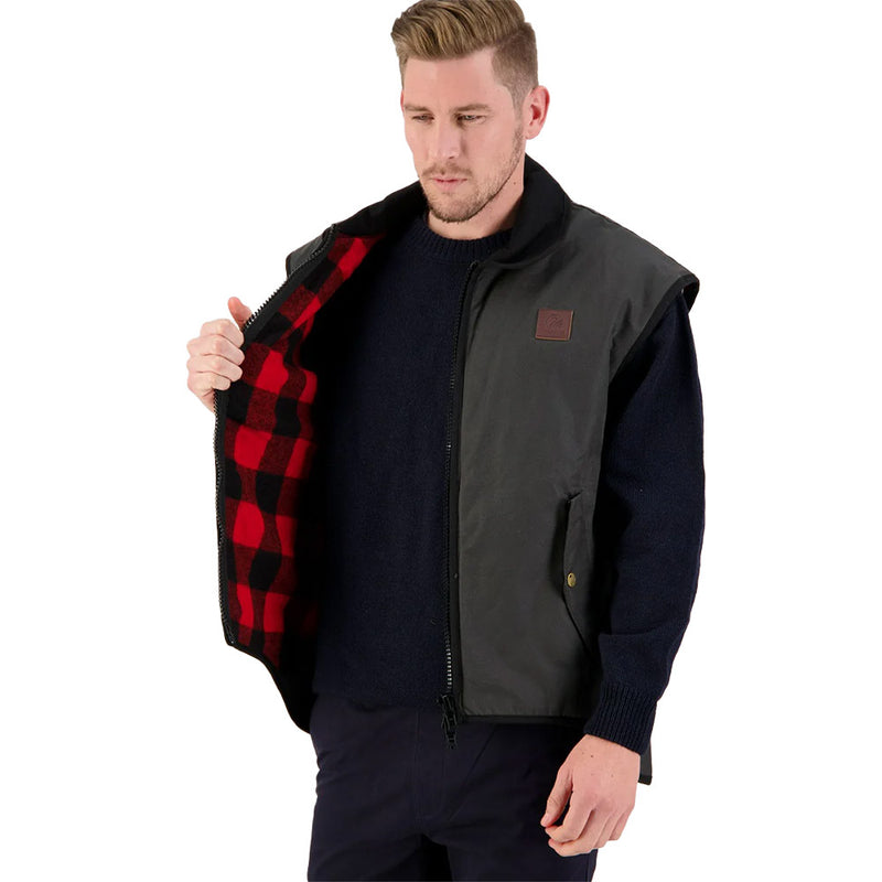 Load image into Gallery viewer, Swanndri Foxton Vest Wool Lined, Brown, featuring a robust waxed cotton exterior and wool-lined collar, designed for outdoor activities with zip-side pockets and a heavy-duty two-way front zipper.