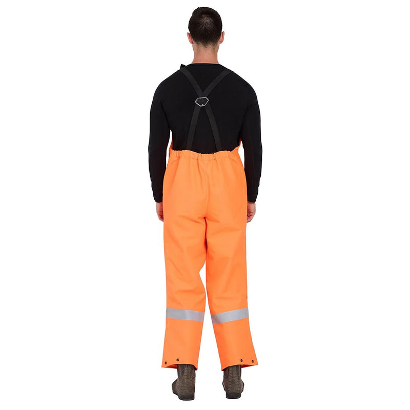 Load image into Gallery viewer, Kaiwaka Stormforce Taped Bib Overtrousers, Orange, featuring high-visibility fabric and reflective silver stripes, worn with suspenders. Designed for waterproof and breathable protection in challenging environments, ideal for safety-conscious workwear.