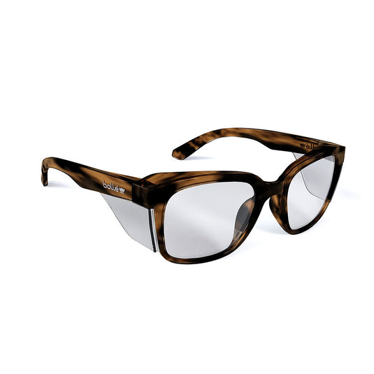 Bolle STKS 410 Safety Glasses: Brown Tortoise/Clear Lens, featuring integrated clear side-shields and advanced coatings. Designed for comfort and protection, ideal for both work and lifestyle balance.