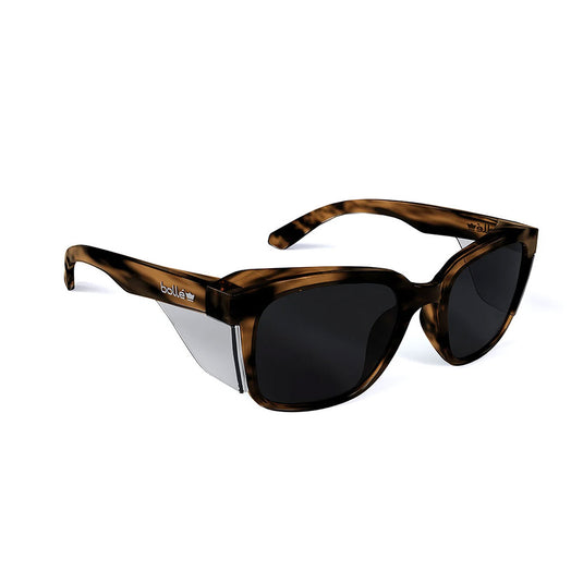 Bolle STKS 410 Safety Glasses featuring black lenses and a sleek black frame, designed for comfort and protection. Ideal for active safety environments, blending style with advanced eye protection technology.