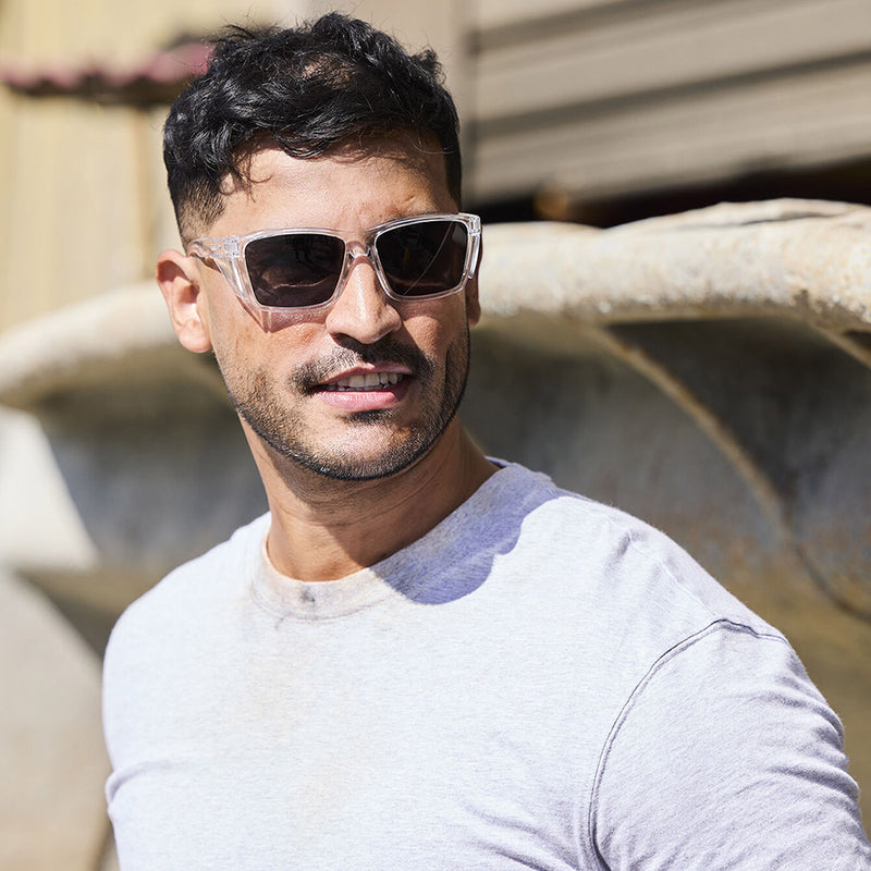 Load image into Gallery viewer, Bolle STKS 420 Safety Glasses: Clear/Smoke Polarised, featuring sleek design with integrated clear side-shields, crafted from 65% recycled polycarbonate for demanding work environments, offering advanced protection and comfort.