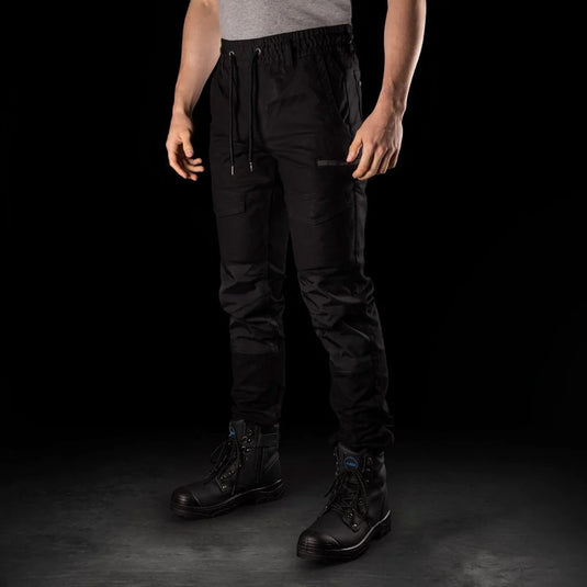 BAD Saviour Cuffed Elastic Waist Work Pants showcased worn with black boots, highlighting their slim fit, adjustable drawstring, reinforced knees, and functional pockets, ideal for safety and workplace use.