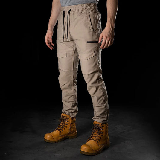 BAD Saviour Cuffed Elastic Waist Work Pants shown with brown boots, featuring a slim fit, reinforced knees and pockets, and an adjustable drawstring for a perfect fit, ideal for active work environments.