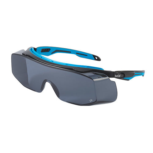 Bolle Tryon OTG Safety Glasses: Smoke, designed for over-the-glasses use, featuring Platinum® anti-scratch and anti-fog coating. Ideal for reducing workplace accidents, ensuring comfort and reliability.