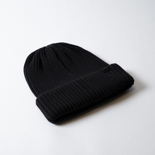 UFlex Fishermans Beanie, a ribbed knit, black fold-over winter hat, crafted from a viscose, nylon, and polyester blend. Features a cuffed hem and one-size-fits-all design, ideal for safety-conscious workwear.