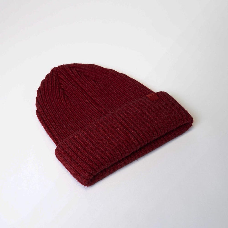 Load image into Gallery viewer, UFlex Fishermans Beanie, a rib-knit hat with a folded cuff, crafted from a viscose, nylon, and polyester blend, laid flat. Ideal for workplace safety, fitting comfortably in uniform settings.