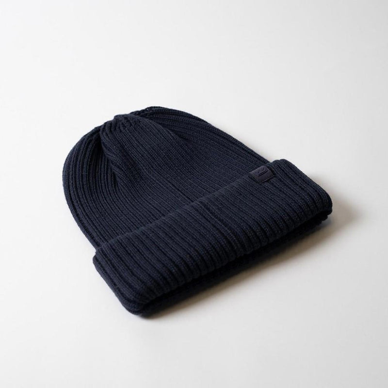 Load image into Gallery viewer, UFlex Fishermans Beanie: A dark navy-blue rib-knit beanie with a cuffed hem and small tag on the front, designed for versatile, comfortable wear—ideal for safety-conscious environments and everyday use.