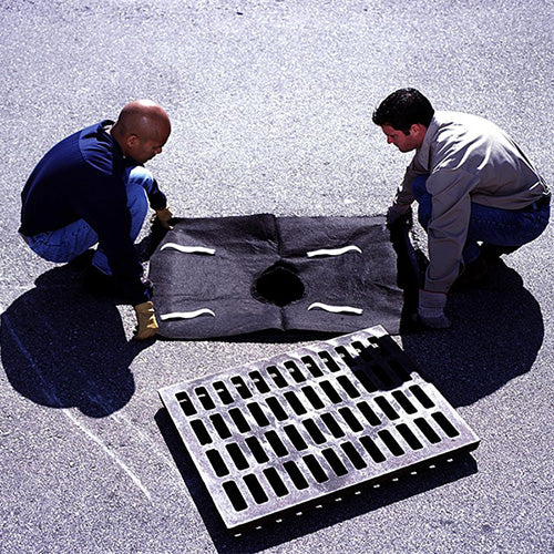 Ultra Drain Guard Plus: Single, displayed with a man installing it over a street grate, designed for effective containment of oil and sediment to protect stormwater systems, ideal for safety and environmental protection.