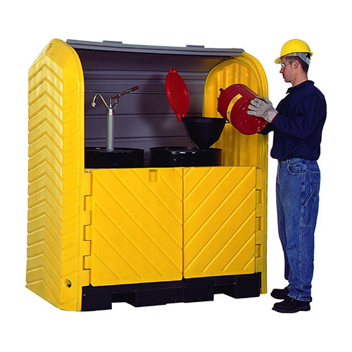 Ultra Hardtop Plus, 2 Drum, being used by a man in a hard hat, pouring a container into another, demonstrating its functionality for safe outdoor storage of hazardous materials.