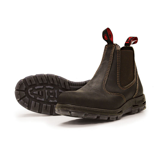 Redback Bobcat Safety Boots with steel toe cap, slip-on design, and elastic sides. Crafted from premium full grain New Zealand leather, featuring durable, slip-resistant soles for optimal safety and comfort.