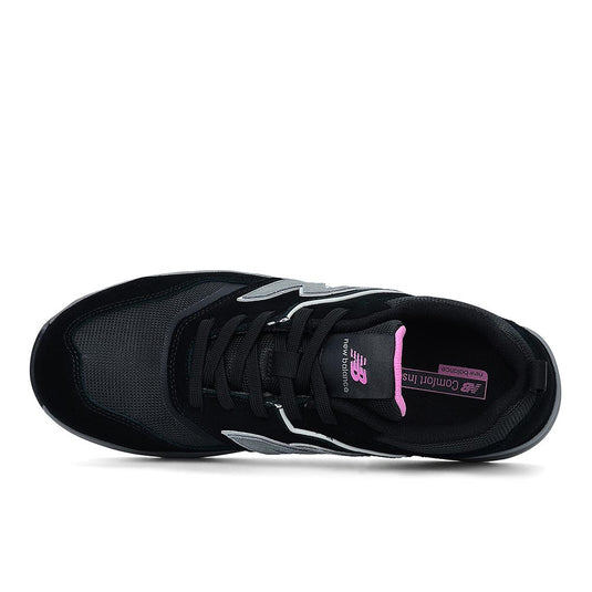 New Balance Elite Lite Womens Safety Shoe, Black/Rose, top view showcasing black leather with silver N logos, pink accents, and composite toe, designed for safety and style in light industrial environments.