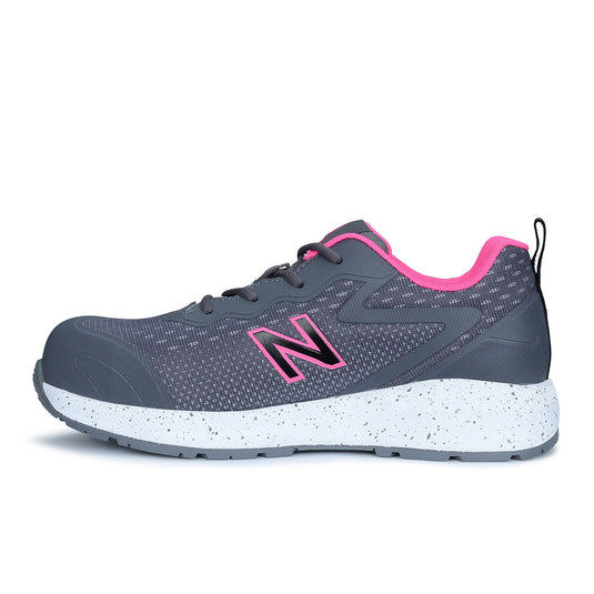 New Balance Logic Women’s Safety Shoe in Grey/Pink, featuring a sleek design with a pink-accented heel and a safety-focused composite toe, ideal for workplace environments.