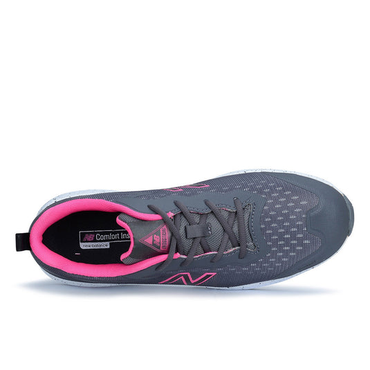 New Balance Logic Women’s Safety Shoe, Grey/Pink, featuring a black and pink zigzag design with a composite toe and slip-resistant outsole, designed for workplace comfort and protection.