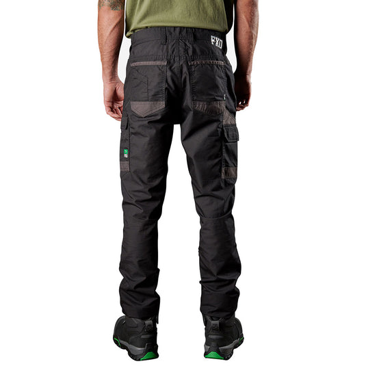 Model wearing FXD WP-5 Stretch Work Pants, showcasing multi-pocket design and reinforced stitching, paired with black boots. Ideal for durability and comfort, reflecting Active Safety's commitment to quality workwear.