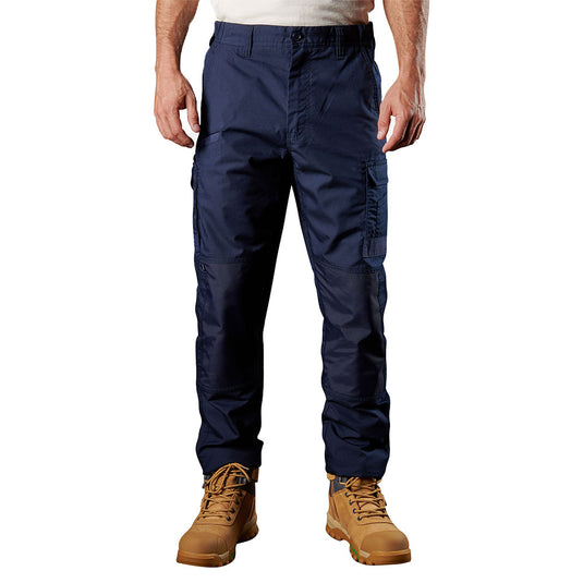 FXD WP-5 Stretch Work Pants, featuring side thigh pockets and paired with tan work boots, exemplify durable, quick-dry workwear designed for enhanced movement and utility in demanding environments.