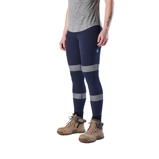 FXD WP-9WT Taped Womens Leggings showcased with reflective stripes and paired with brown boots, highlighting their function and comfort, ideal for active women in demanding work environments.