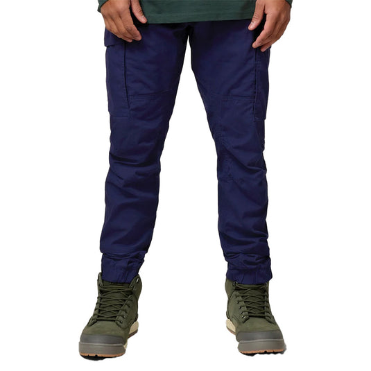 Hard Yakka 3056 Cuffed Cotton Cargo Pants feature a slim, articulated fit with durable stretch canvas, reinforced pockets, and multiple storage options, reflecting functional workwear practicality with recycled materials.